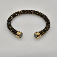 Lade das Bild in den Galerie-Viewer, SWAROVSKI Crystaldust Armreif Größe S Dark Gold 5372883