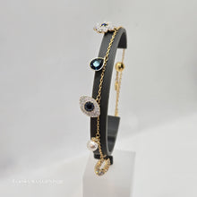 Lade das Bild in den Galerie-Viewer, SWAROVSKI Symbolica Armband Evil Eye Glücksklee und Hufeisen, Blau, Goldlegierungsschicht 5692162