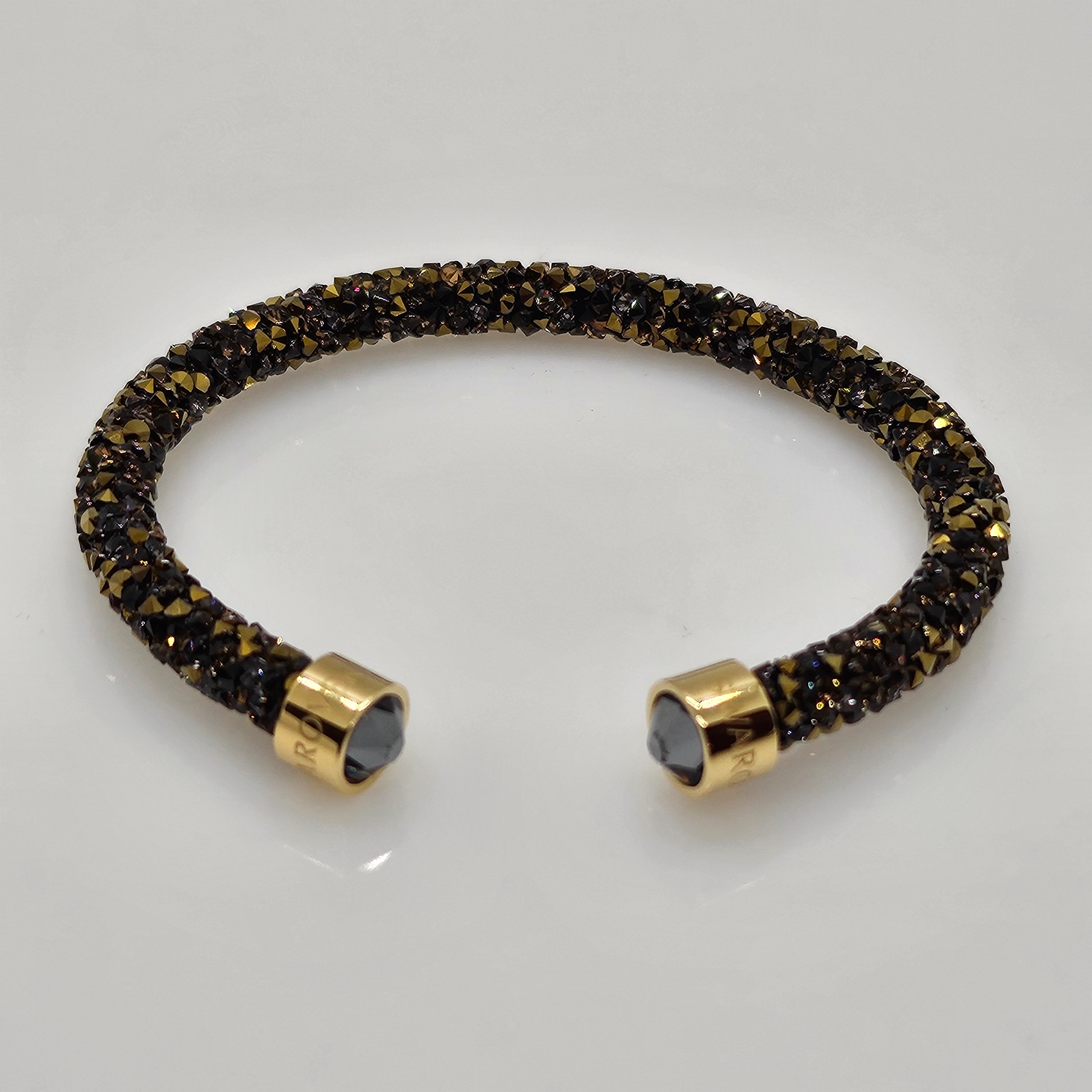 SWAROVSKI Crystaldust Armreif Größe M Dark Gold 5348101