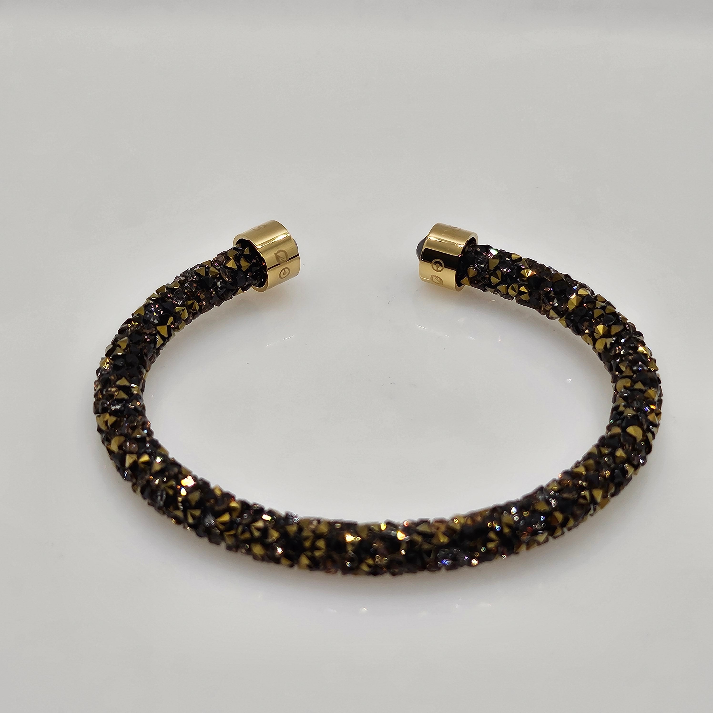SWAROVSKI Crystaldust Armreif Größe M Dark Gold 5348101
