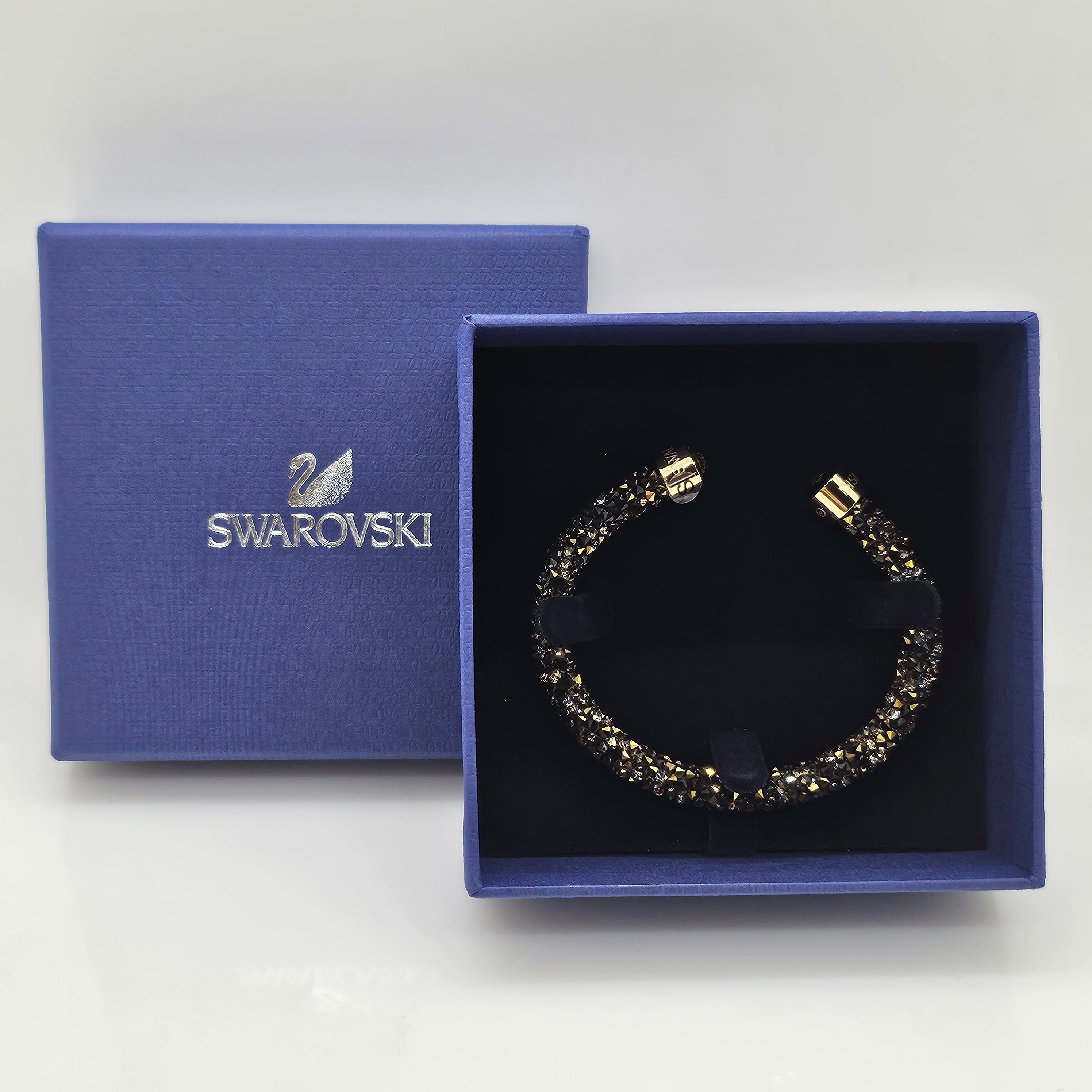 SWAROVSKI Crystaldust Armreif Größe S Dark Gold 5372883 oU