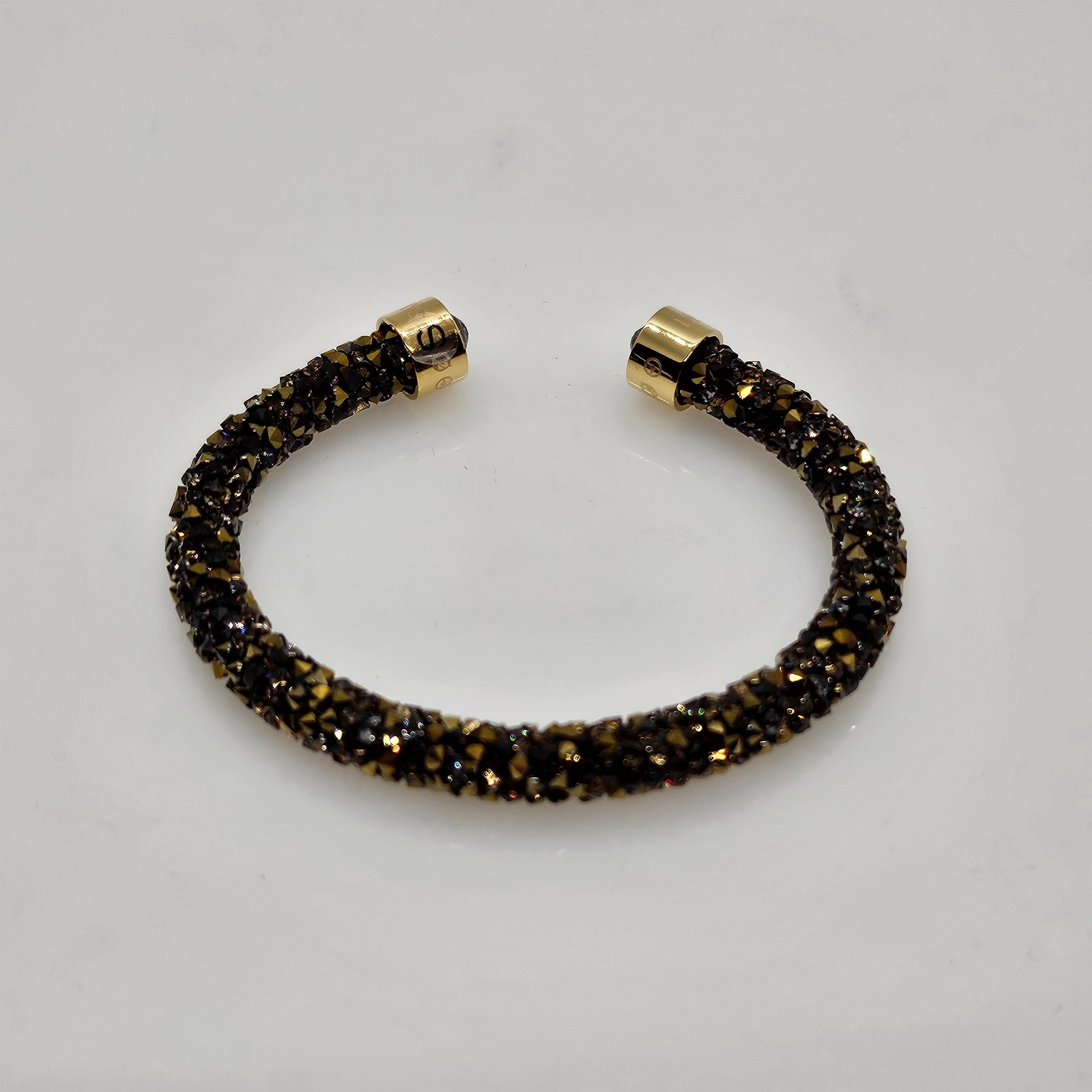 SWAROVSKI Crystaldust Armreif Größe S Dark Gold 5372883