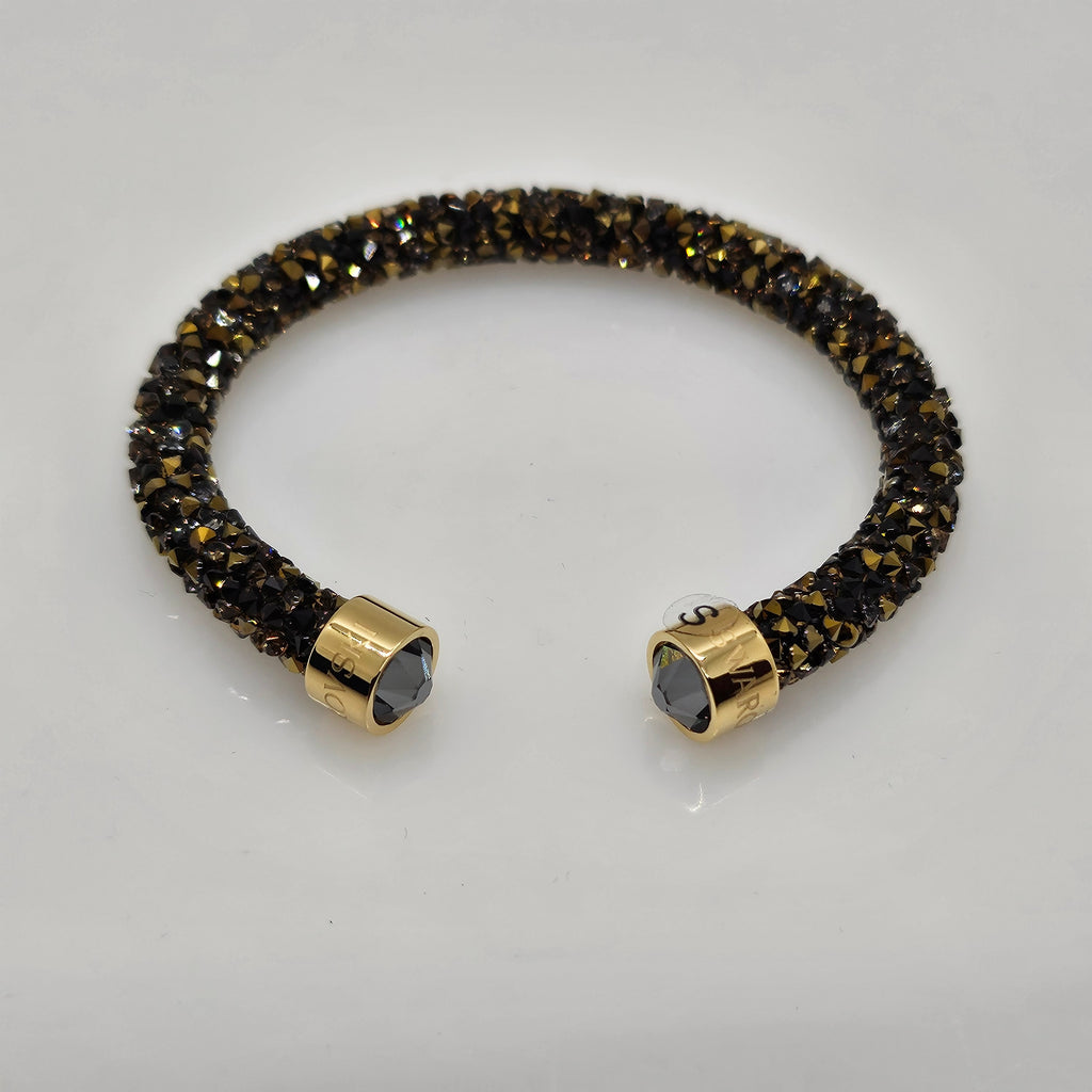 SWAROVSKI Crystaldust Armreif Größe S Dark Gold 5372883