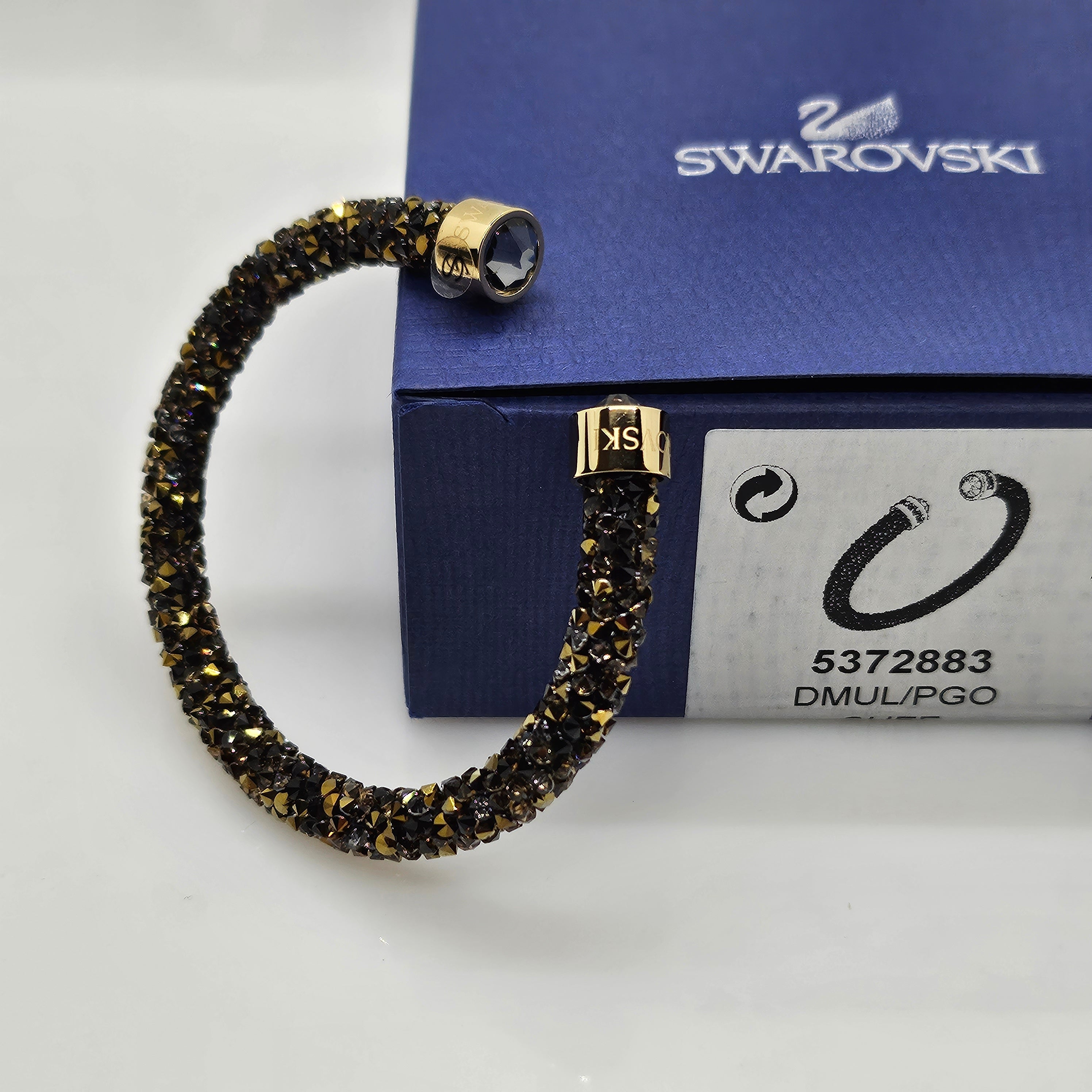 SWAROVSKI Crystaldust Armreif Größe S Dark Gold 5372883