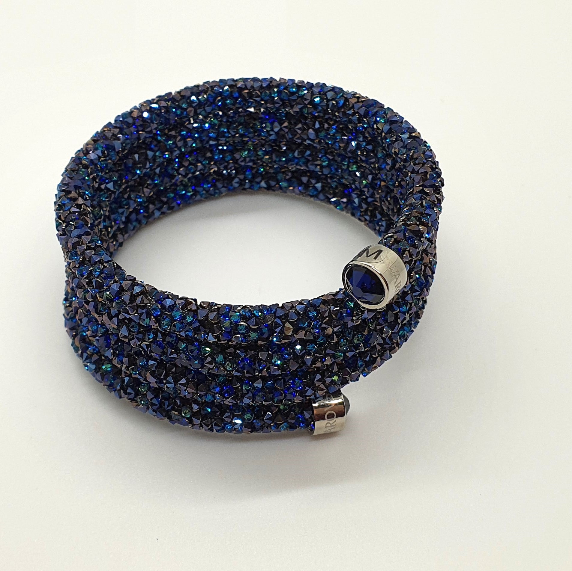 SWAROVSKI Crystaldust Triple Armreif Größe M Blau 5294804