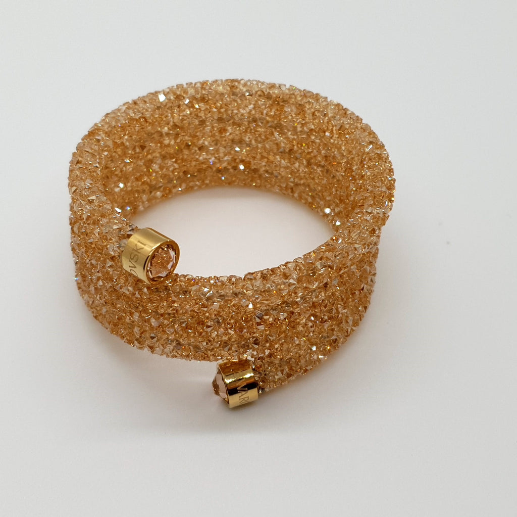 SWAROVSKI Crystaldust Triple Armreif Größe S Gold 5292446