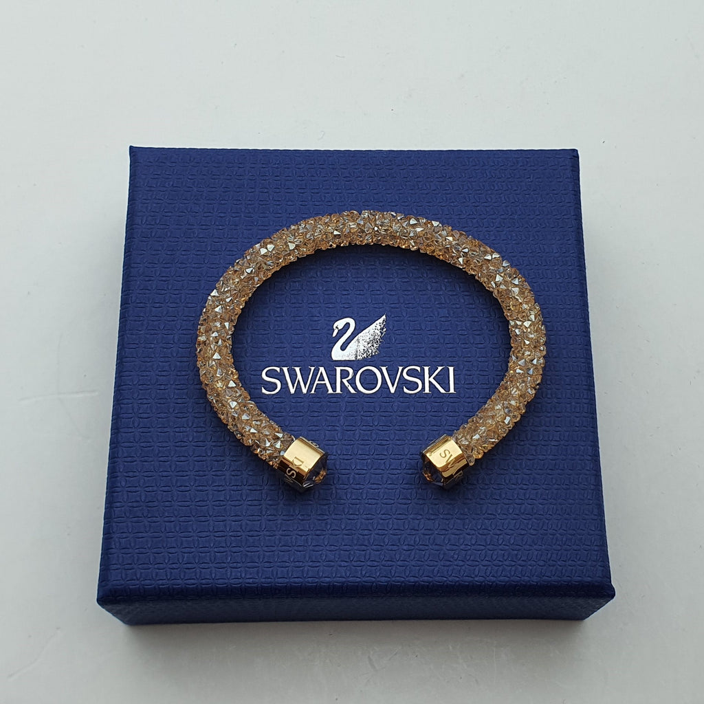 SWAROVSKI Crystaldust Armreif Größe S Gold 5255897 oU