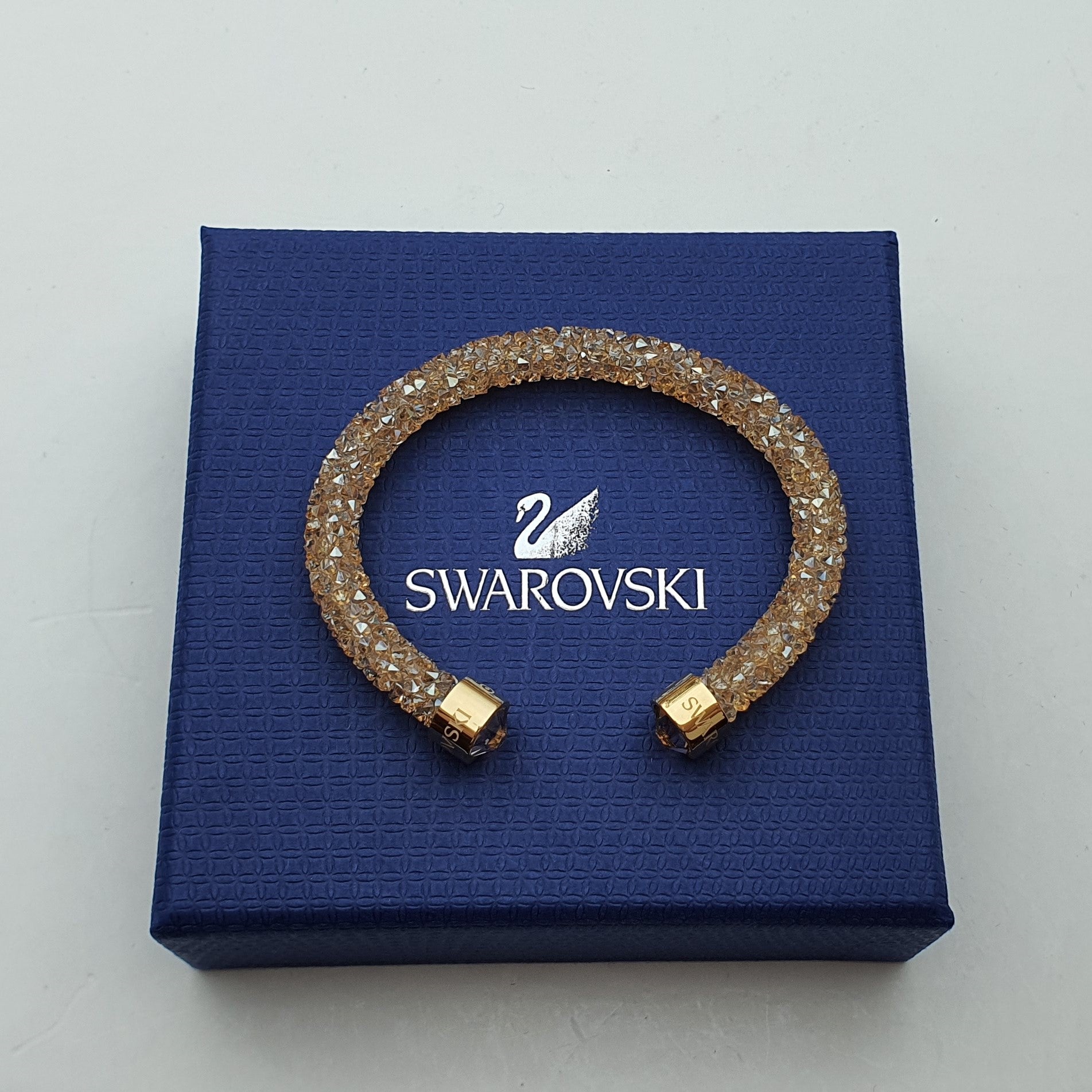 SWAROVSKI Crystaldust Armreif Größe S Gold 5255897 oU