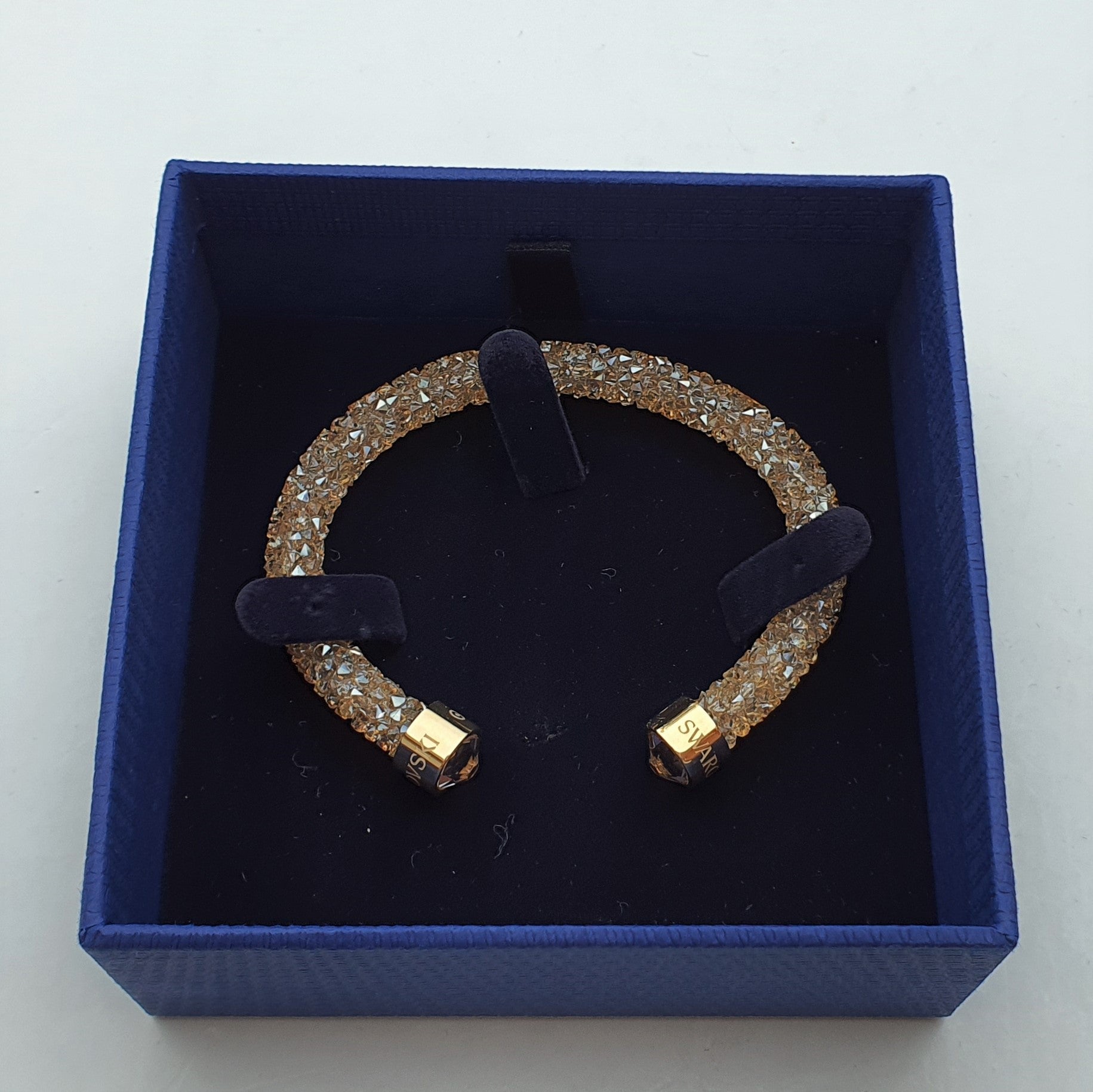 SWAROVSKI Crystaldust Armreif Größe S Gold 5255897 oU