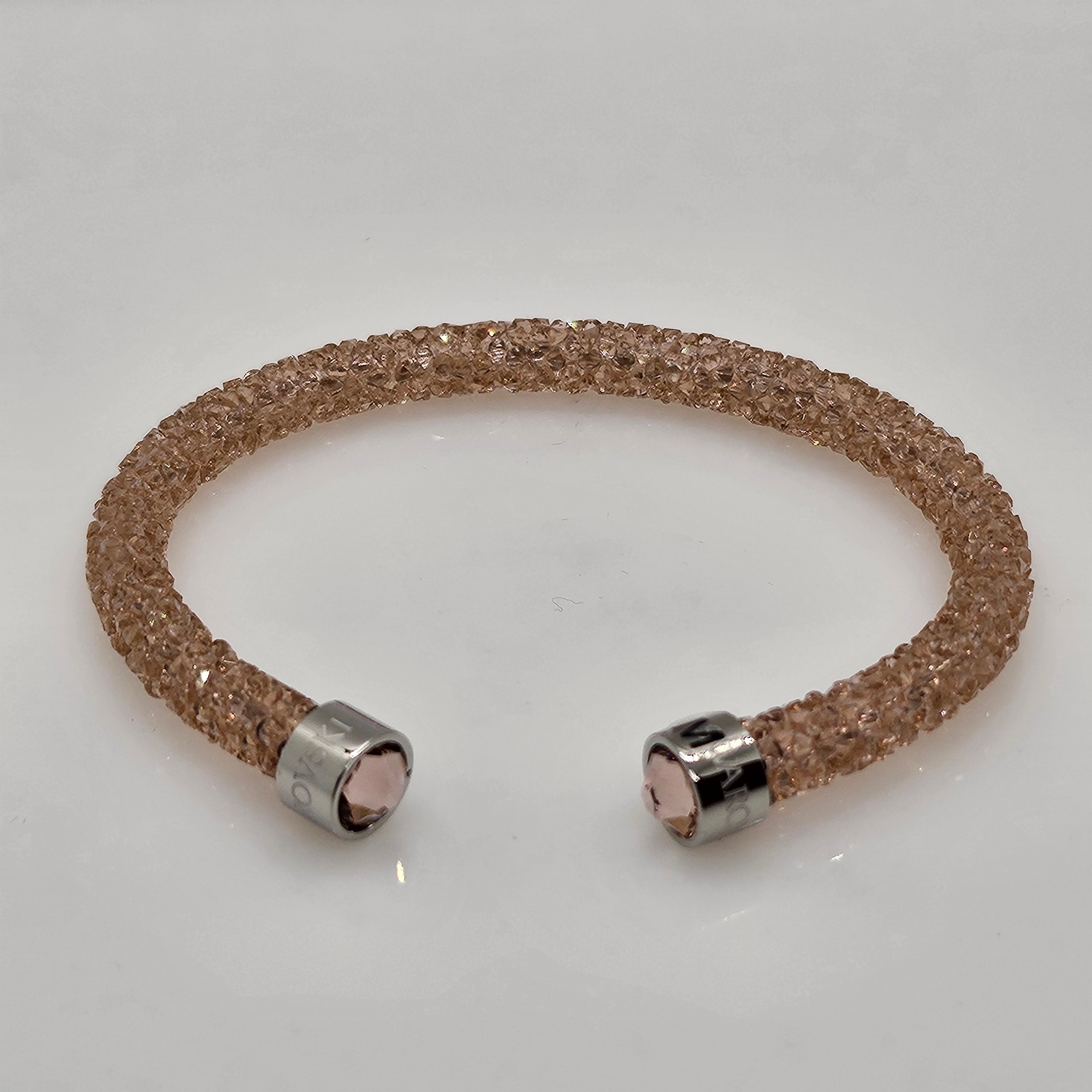 SWAROVSKI Crystaldust Armreif Größe M Rosa Pink 5273638