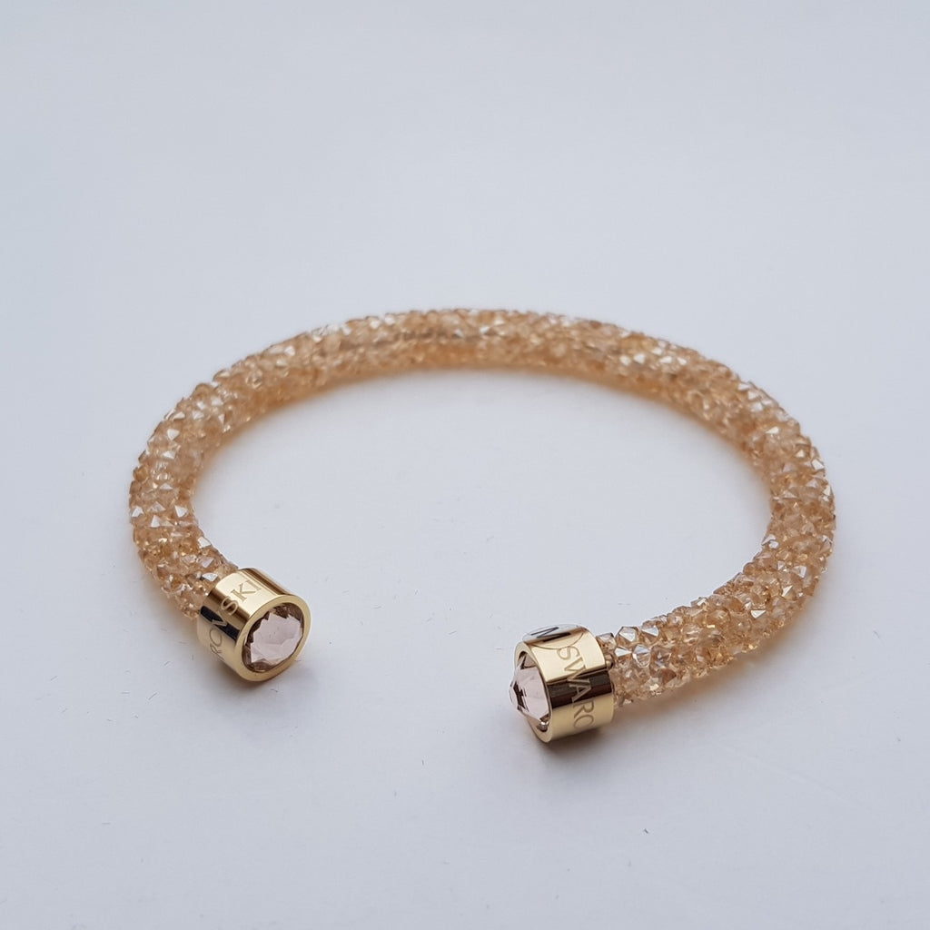 SWAROVSKI Crystaldust Armreif Größe M Gold 5250067 oU