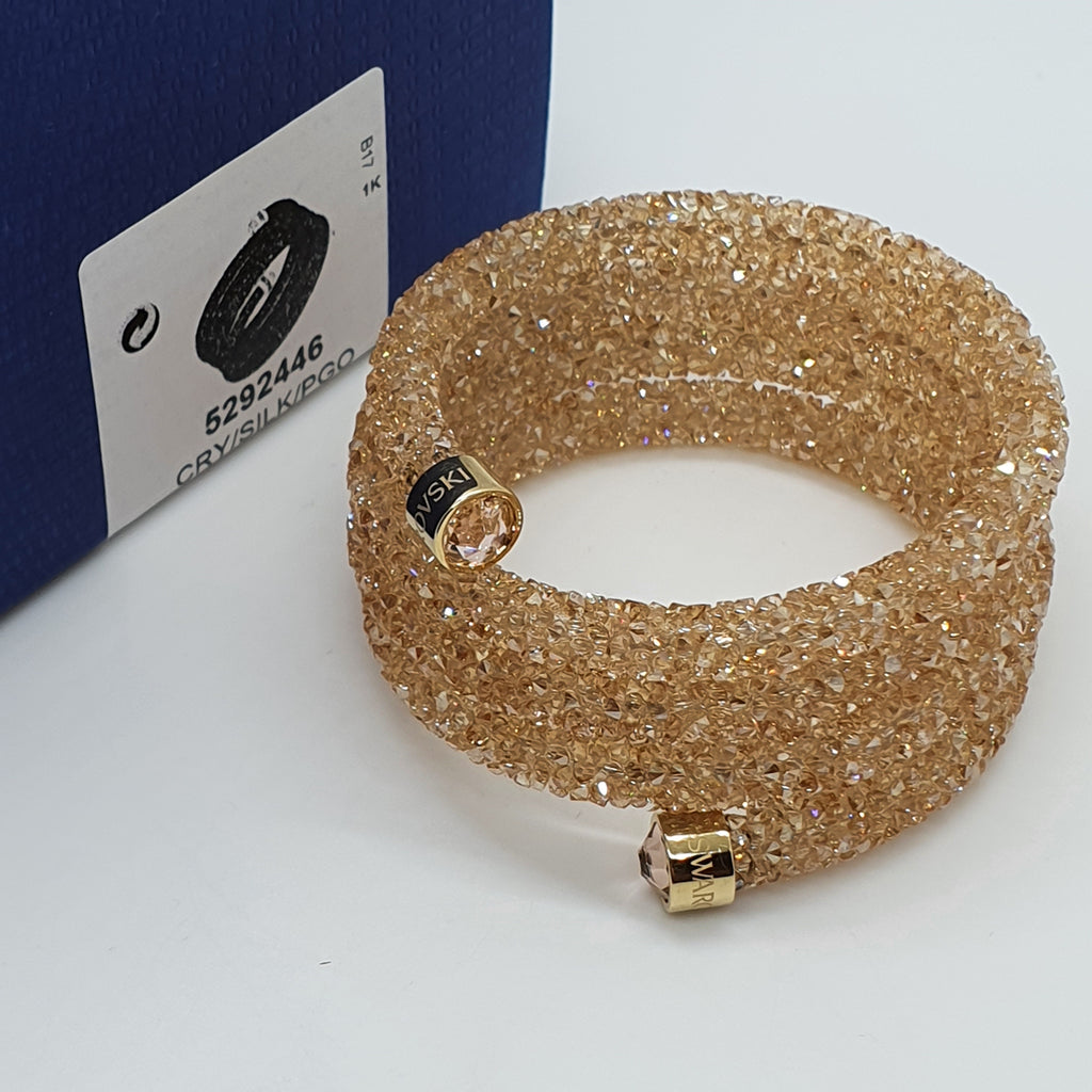SWAROVSKI Crystaldust Triple Armreif Größe S Gold 5292446