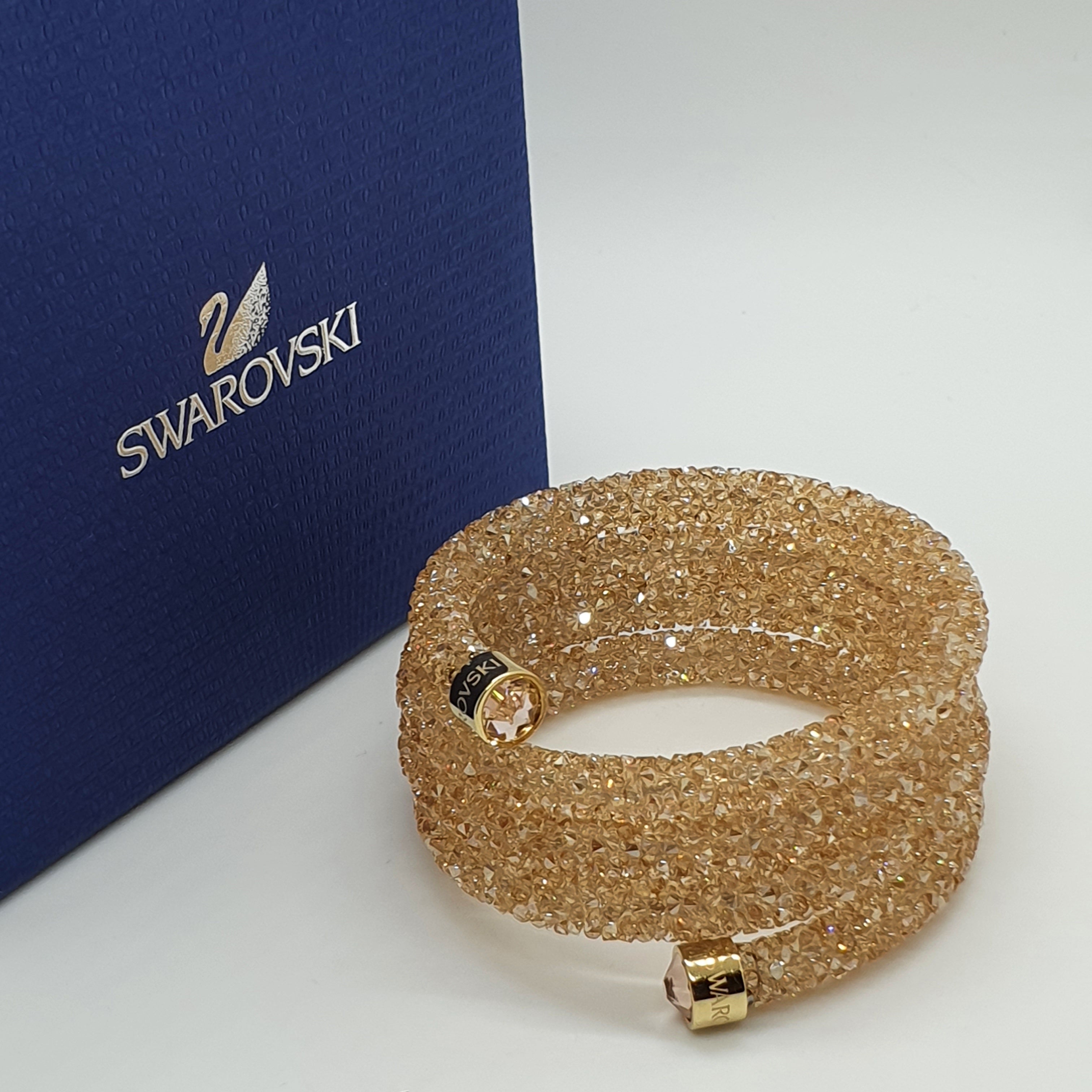 SWAROVSKI Crystaldust Triple Armreif Größe S Gold 5292446
