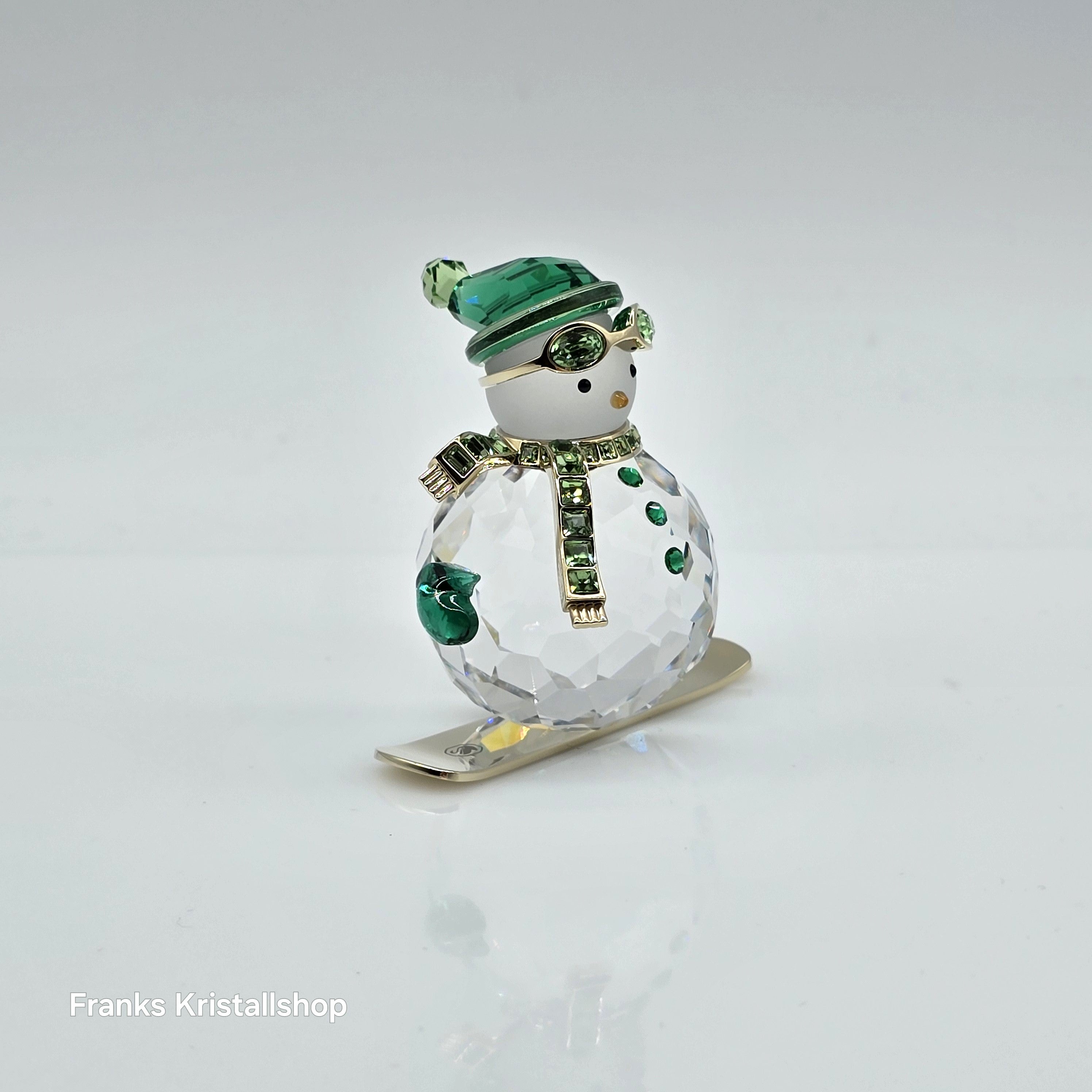 SWAROVSKI Holiday Cheers Dulcis Schneemann auf Snowboard Grün 5687168