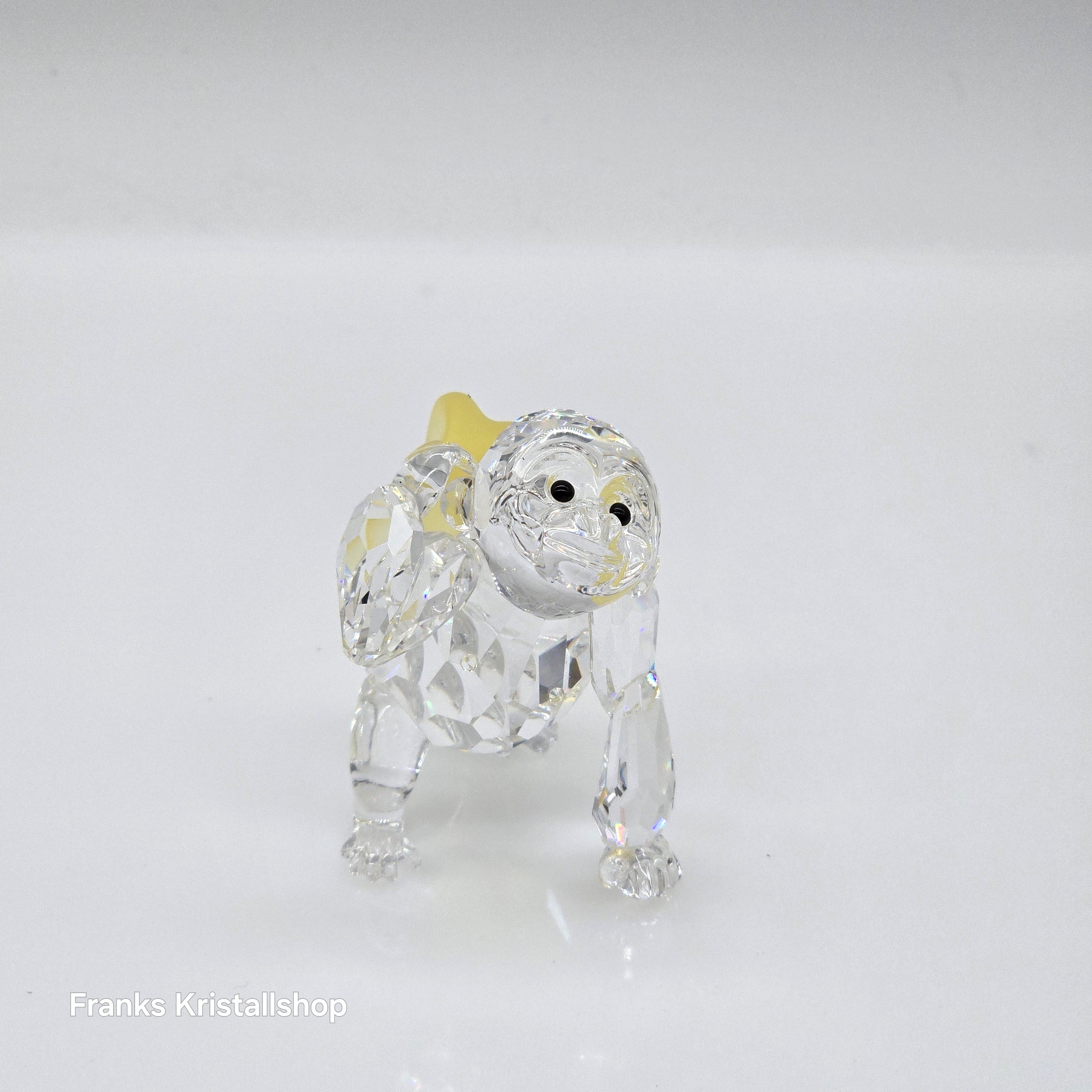 SWAROVSKI Junger Gorilla mit Bananen 273394