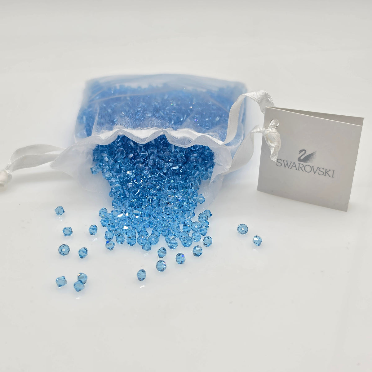 SWAROVSKI Kristall Dekosteine Doppelkegel Perlen 4 mm Aquamarin