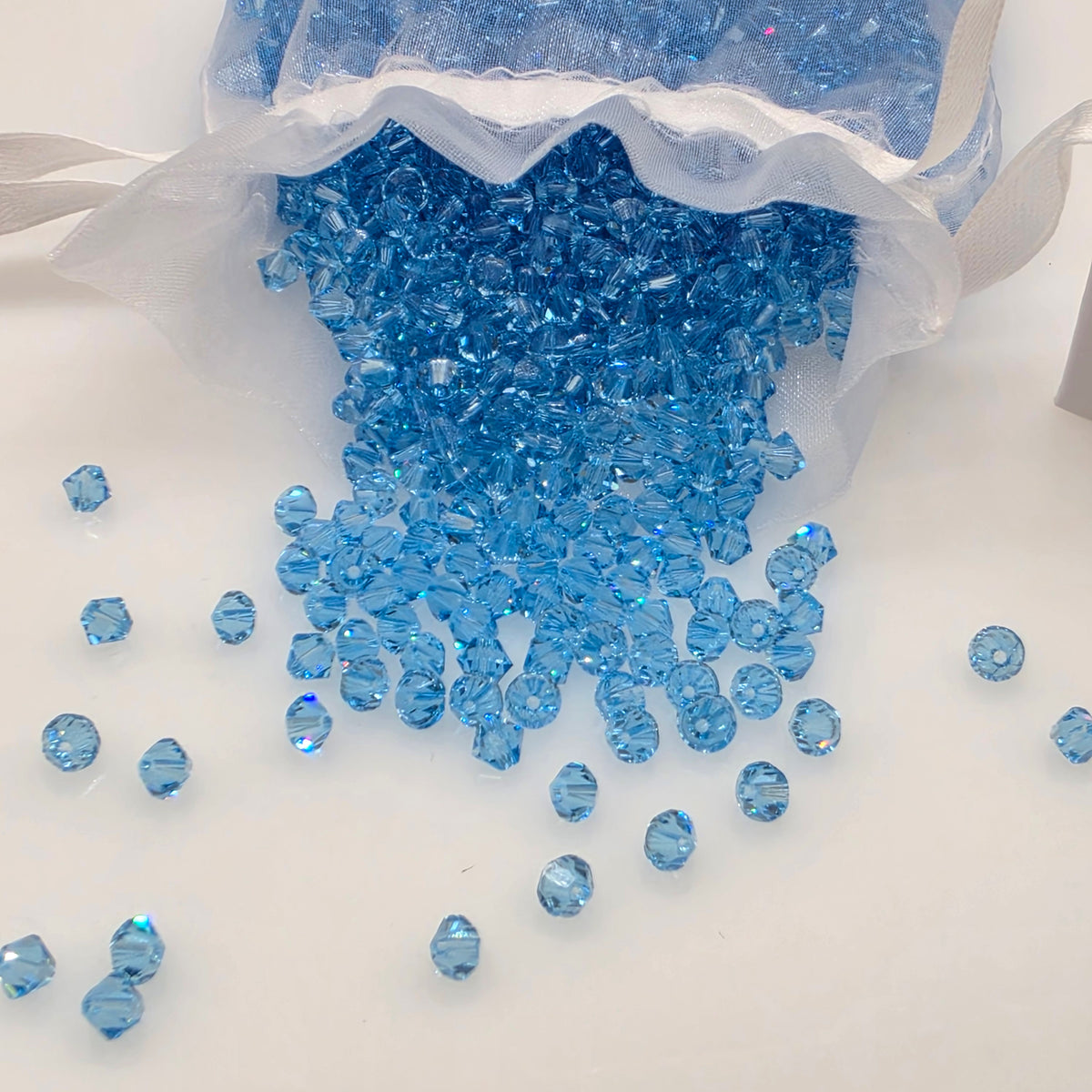 SWAROVSKI Kristall Dekosteine Doppelkegel Perlen 4 mm Aquamarin