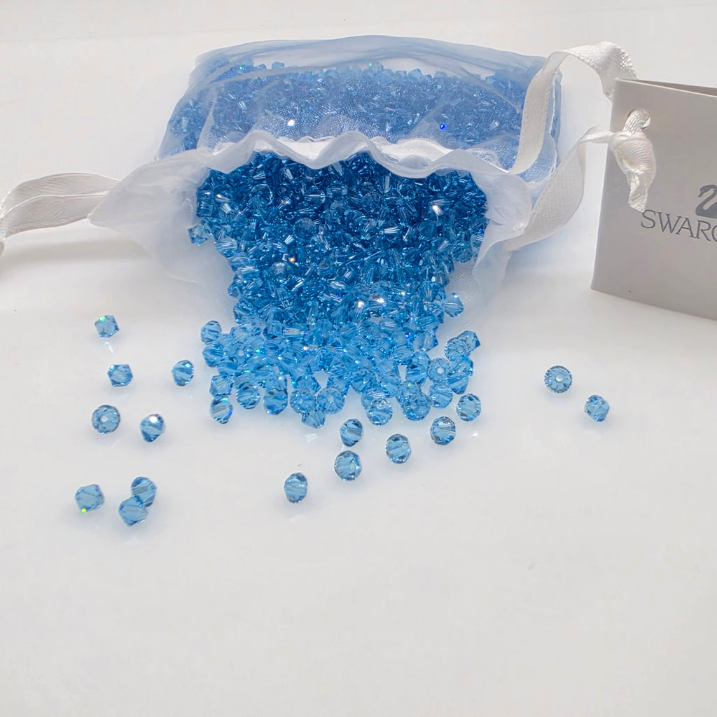 SWAROVSKI Kristall Dekosteine Doppelkegel Perlen 4 mm Aquamarin