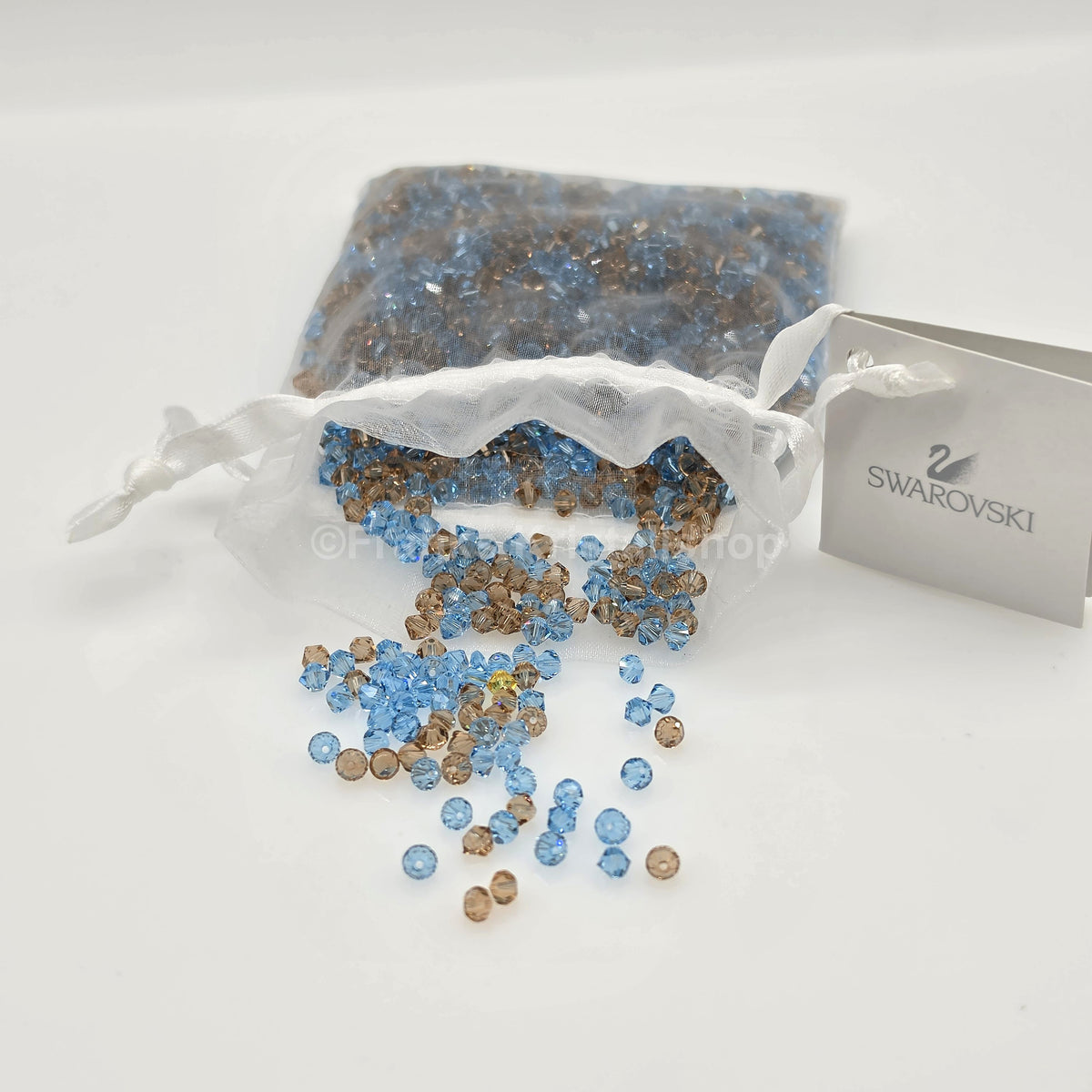 SWAROVSKI Kristall Dekosteine Doppelkegel Perlen 4 mm Blau-Braun