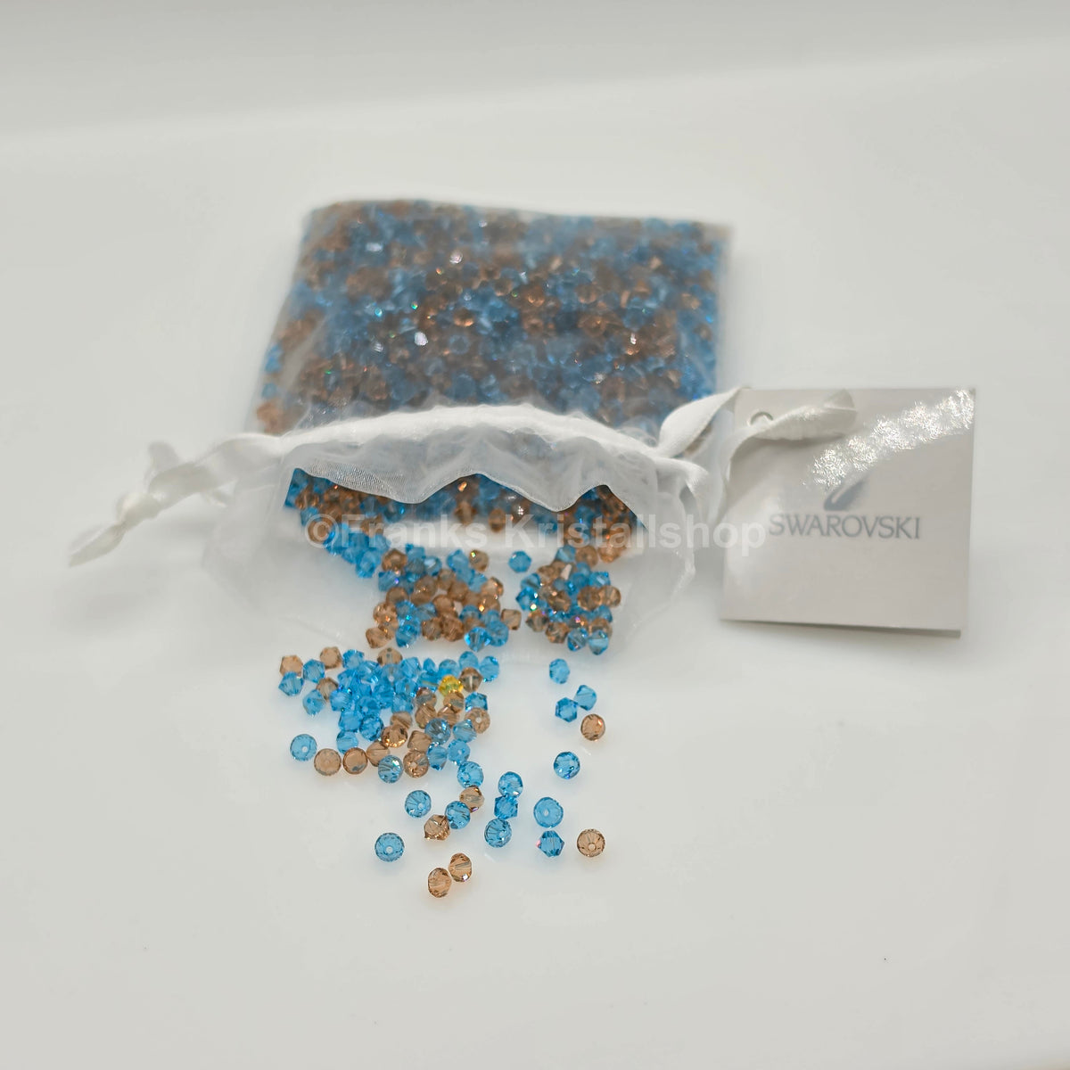 SWAROVSKI Kristall Dekosteine Doppelkegel Perlen 4 mm Blau-Braun