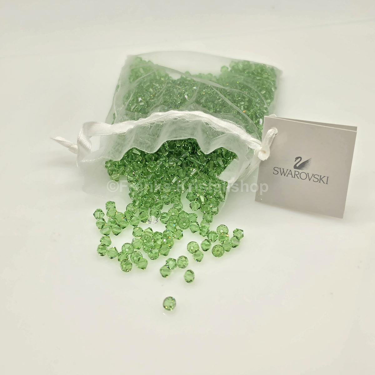 SWAROVSKI Kristall Dekosteine Doppelkegel Perlen 4 mm  Peridot Grün