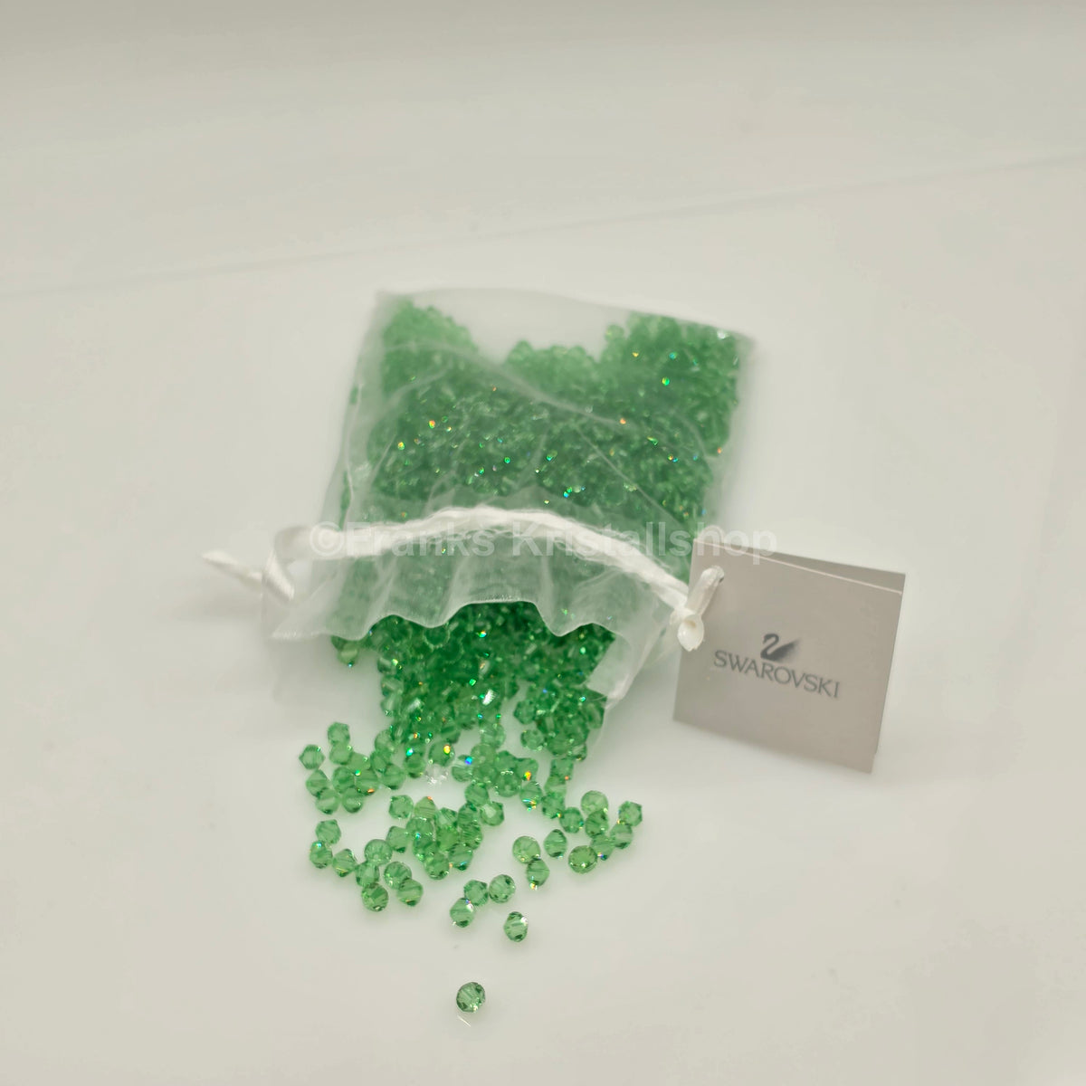 SWAROVSKI Kristall Dekosteine Doppelkegel Perlen 4 mm  Peridot Grün