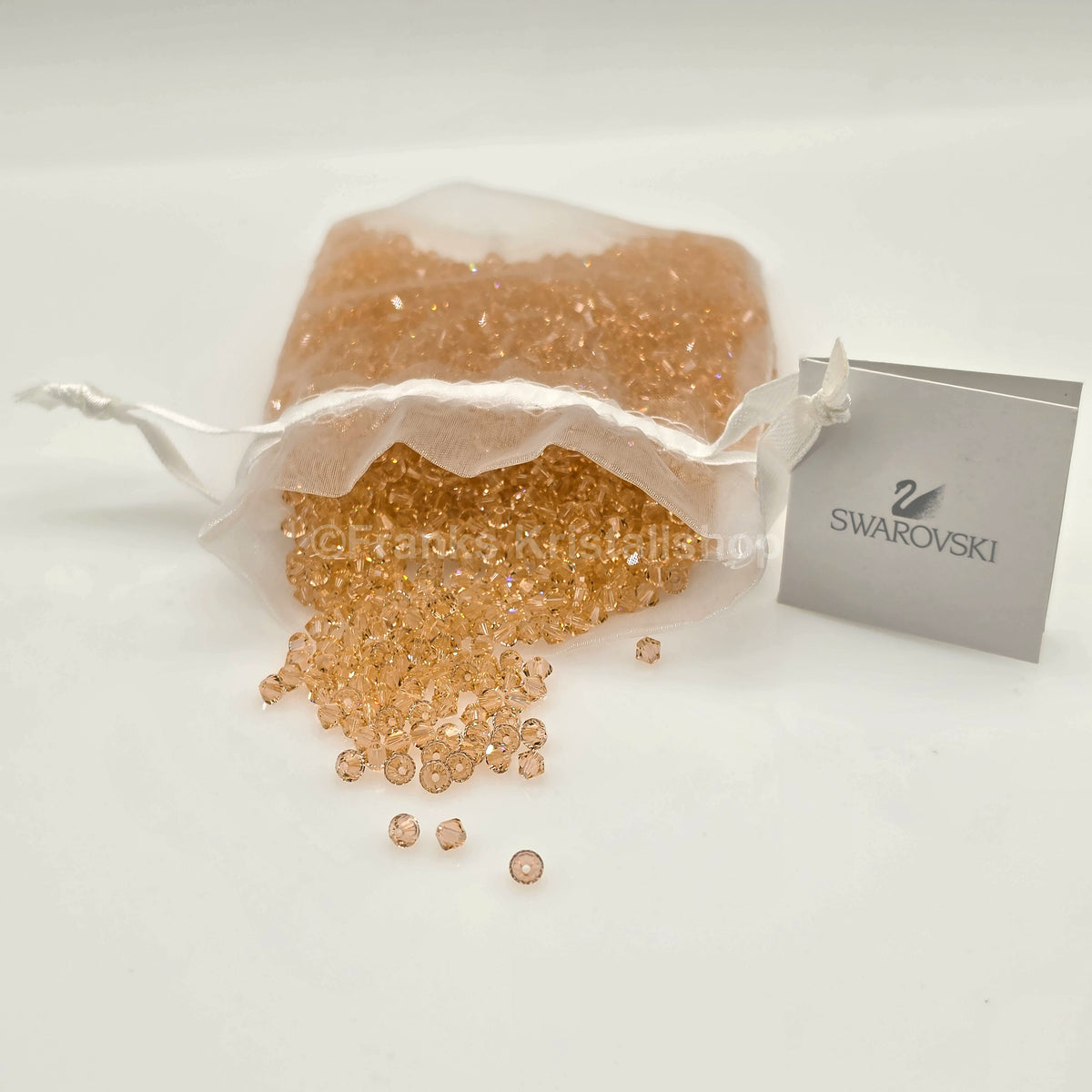 SWAROVSKI Kristall Dekosteine Doppelkegel Perlen 4 mm Peach
