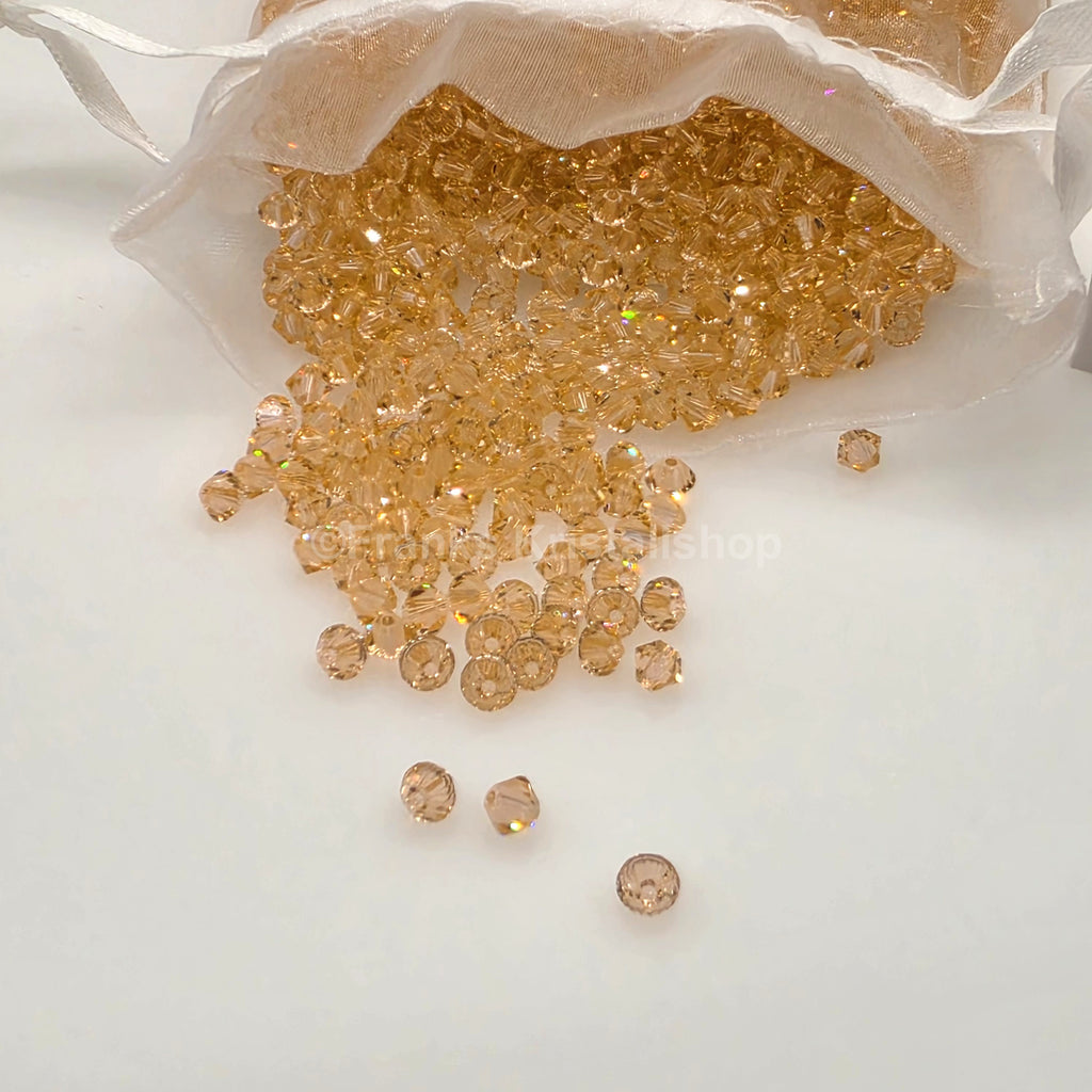 SWAROVSKI Kristall Dekosteine Doppelkegel Perlen 4 mm Peach