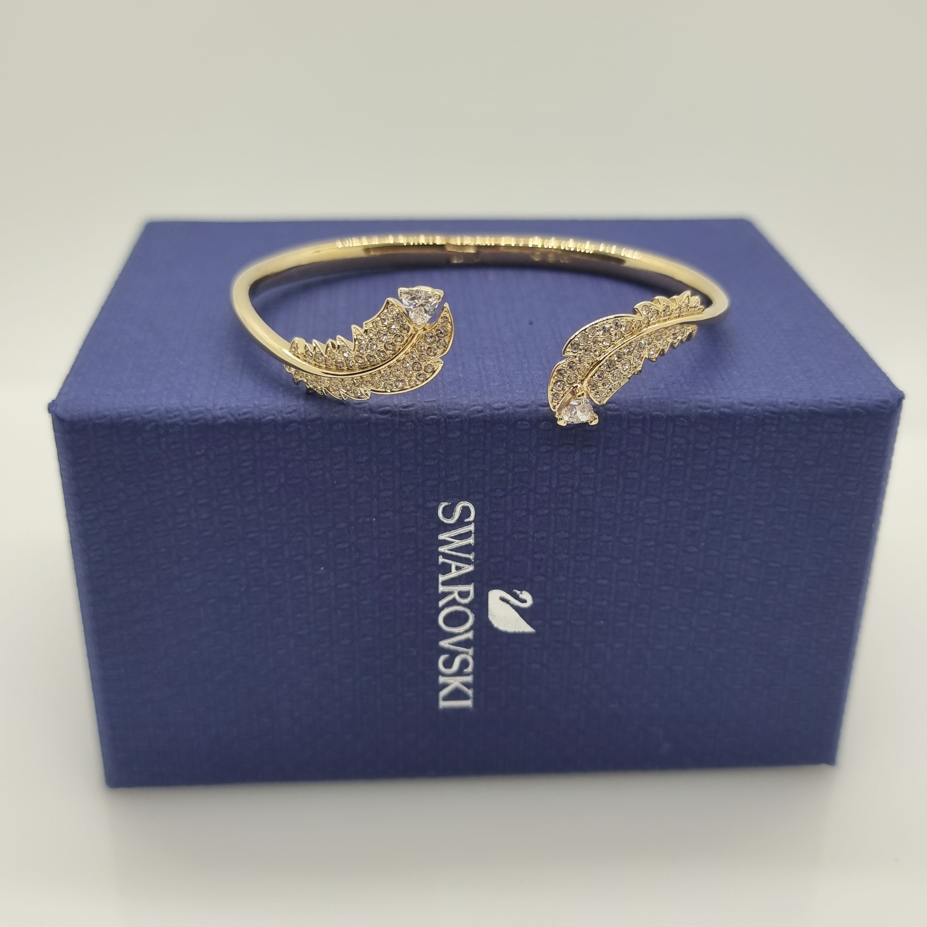 SWAROVSKI Nice Feder Armreif Größe S Weiß, Vergoldet 5515019
